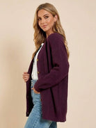 Relaxed fit oversized button down knitwear cardigan in deep purple worn with casual jeans and white top