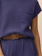 Woman wearing comfy couture knit sweater two-piece set in relaxed fit with matching pants