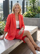 Stylish blazer and shorts two-piece set on white background