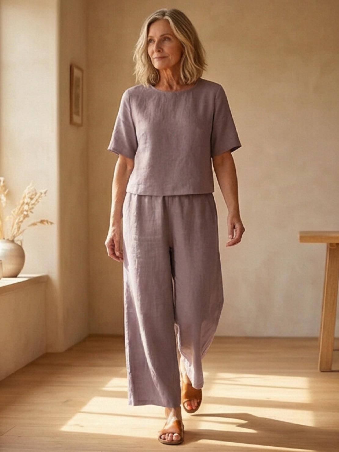 Woman wearing a loose fit co-ord set with soft-tailored top and wide-leg bottoms in breathable fabric