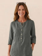 Women’s timeless cotton dress with button front and rolled ¾ sleeves in muted gray color