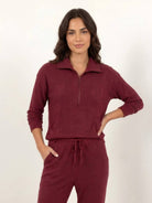 Unisex half-zip pullover and sweatpants set in soft, flexible fabric for relaxed fit and everyday comfort