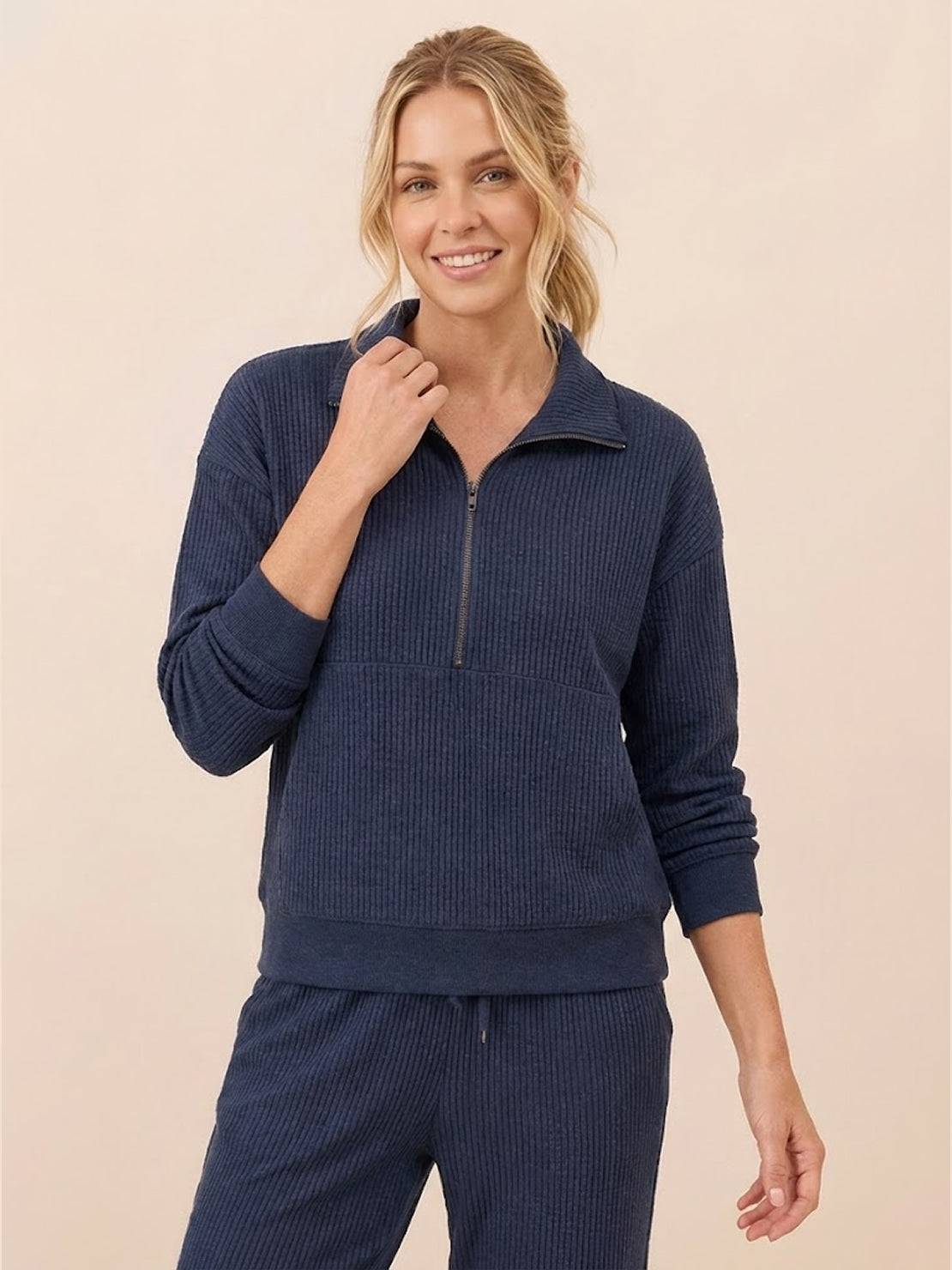 Unisex half-zip pullover and matching sweatpants set in relaxed fit for everyday comfort