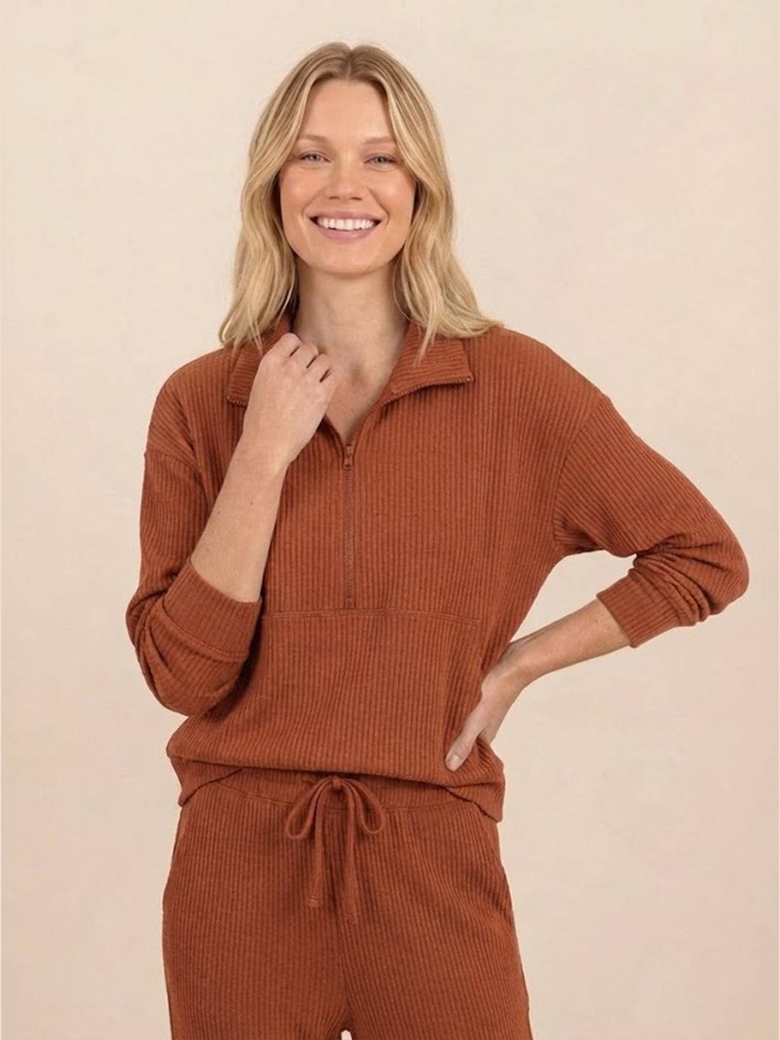 Unisex half-zip pullover and matching sweatpants set in soft fabric for casual comfort and relaxed fit