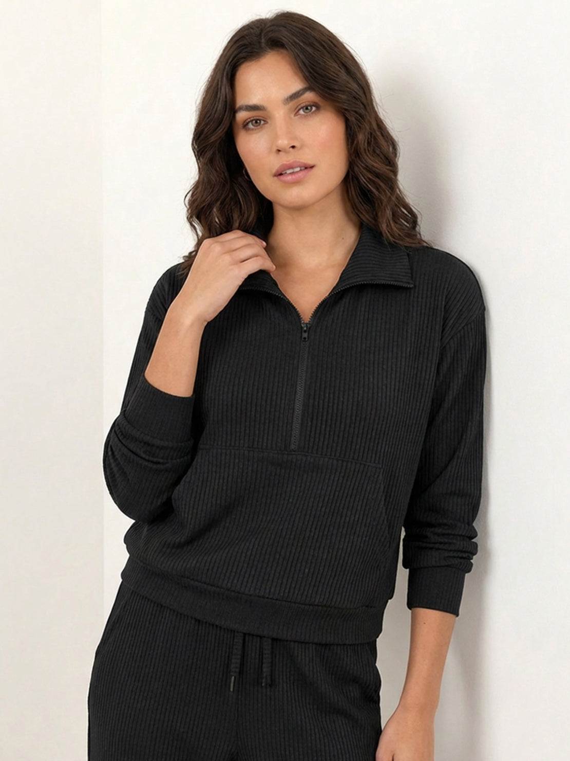Unisex half-zip pullover and sweatpants set in soft, flexible fabric for casual comfort and travel