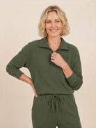 Unisex half-zip pullover and matching sweatpants set in soft polyester blend for casual comfort