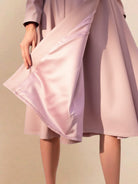 Water-repellent A-line hooded raincoat with insulated lining and matching belt for women