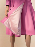 Water-repellent A-line hooded raincoat with insulated lining and matching belt for women