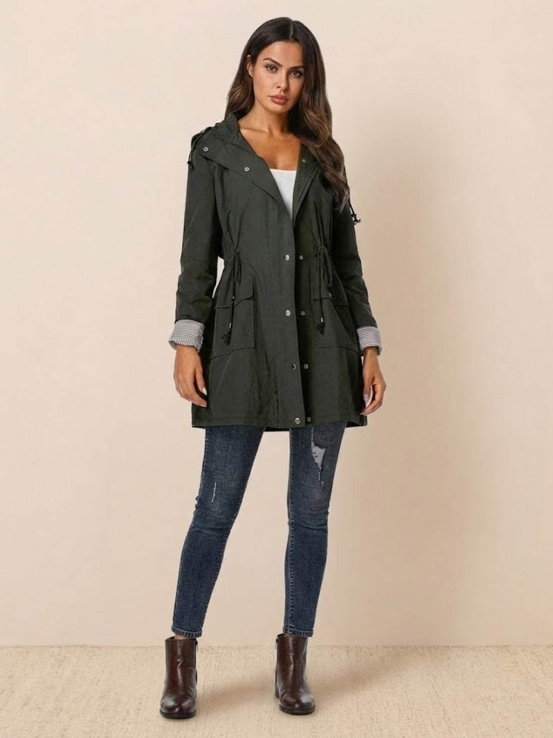 Women wearing a stylish water resistant windbreaker jacket with hood and drawstring waist