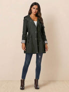Women wearing a stylish water resistant windbreaker jacket with hood and drawstring waist